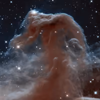 Horsehead Nebula in infrared, a dark tower of gas and dust shaped like a horse's head