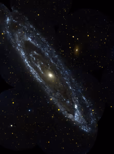Andromeda galaxy in ultraviolet light, with blue spiral arms around a golden core