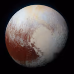 Pluto in enhanced color, with a pale heart-shaped plain and reddish regions