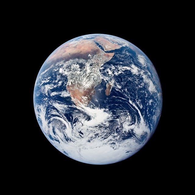 The whole Earth, with Africa and Antarctica under swirling white clouds
